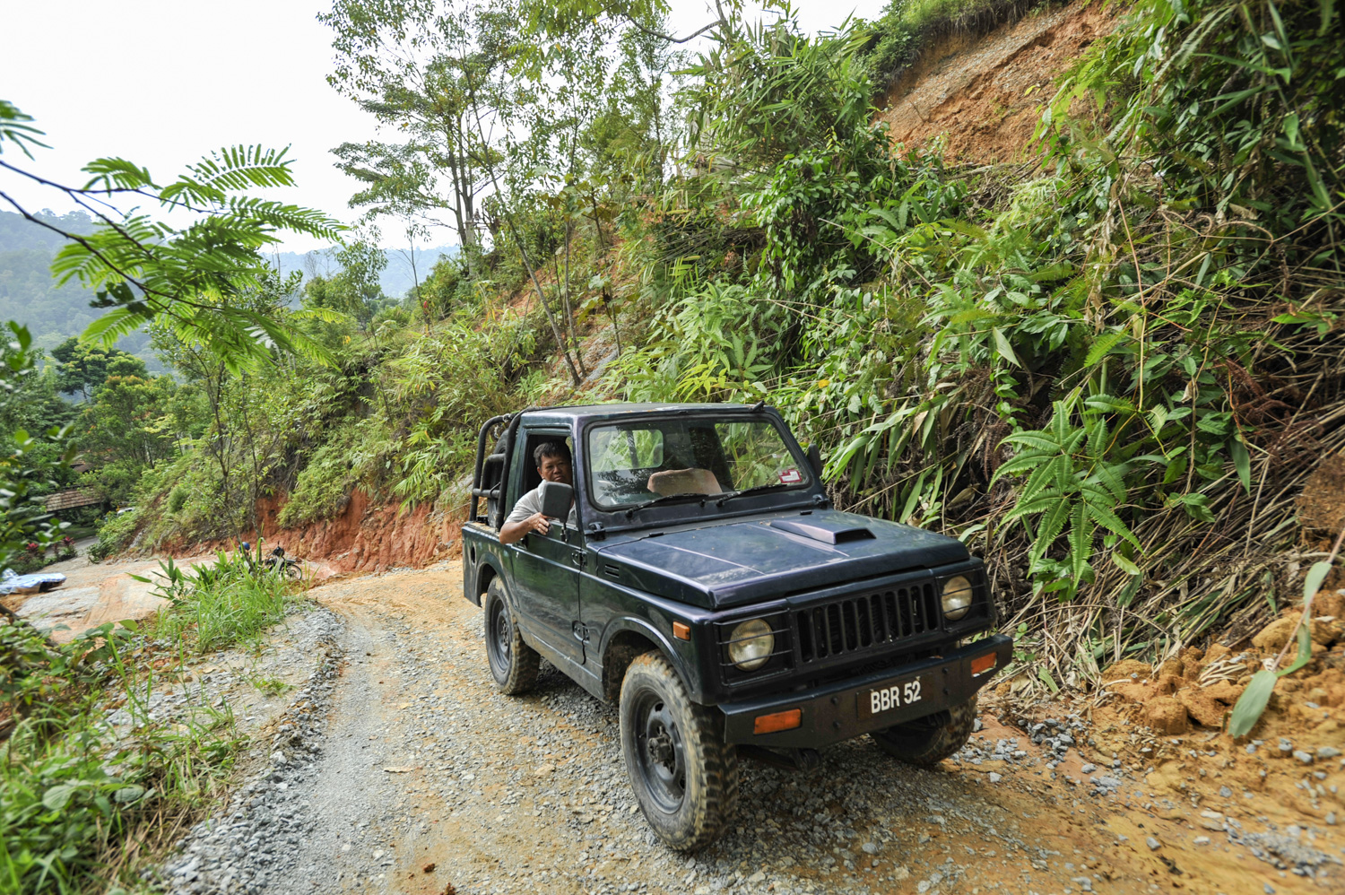 Tin, the experienced builder for Spyder Hill driving his Suzuki 4wd up the driveway.